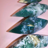 Moss Agate Prism on pink background