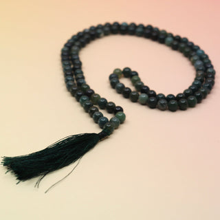 Moss Agate 108 Mala Necklace on pink and orange background