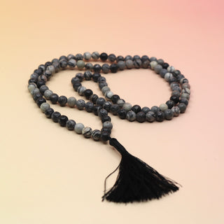 Net Jasper 108 Mala Necklace on pink and orange background