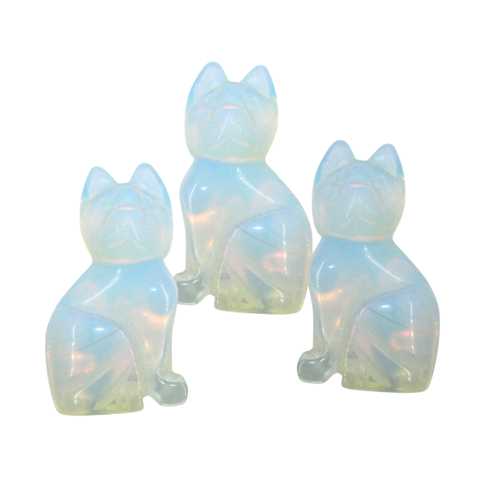 Set of three iridescent cat-shaped Opalite Stones on a white background