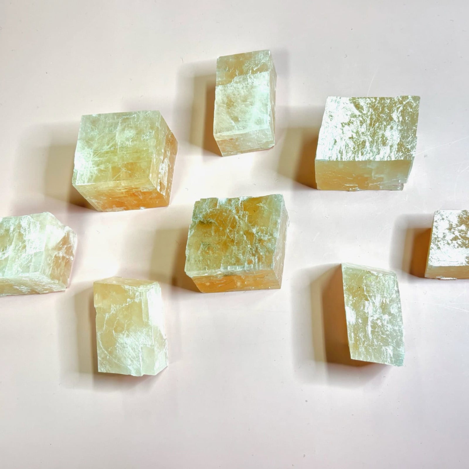 Selection of optical calcite cubes laid out on a light surface