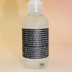Bottle with a label on a beige background