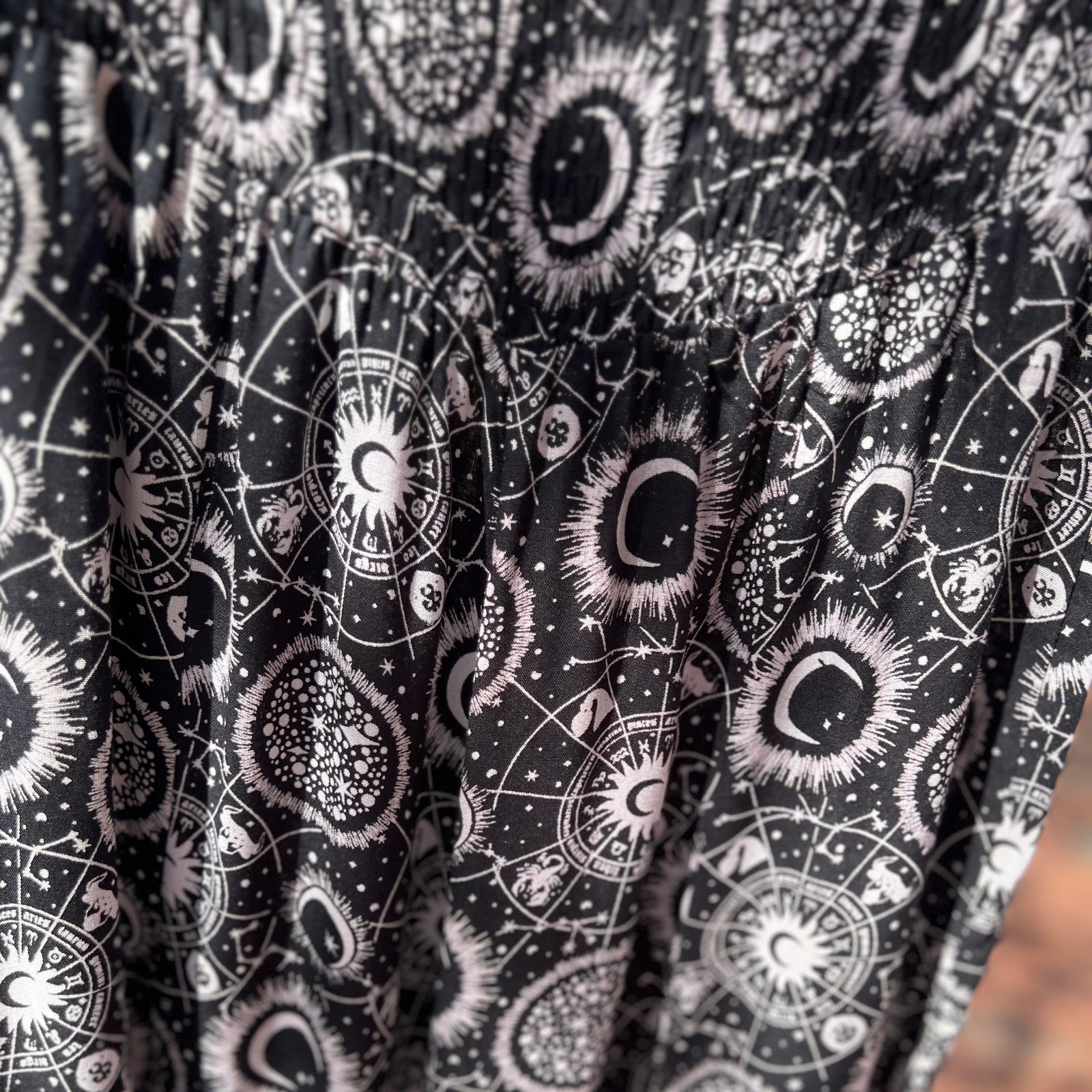 An up close image of the black Celestial Faux Wrap Pants.