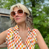 girl in 1970s Gingham Belted Romper in front of green VW vintage bus