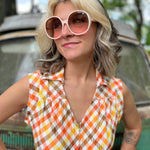 girl in 1970s Gingham Belted Romper in front of green VW vintage bus