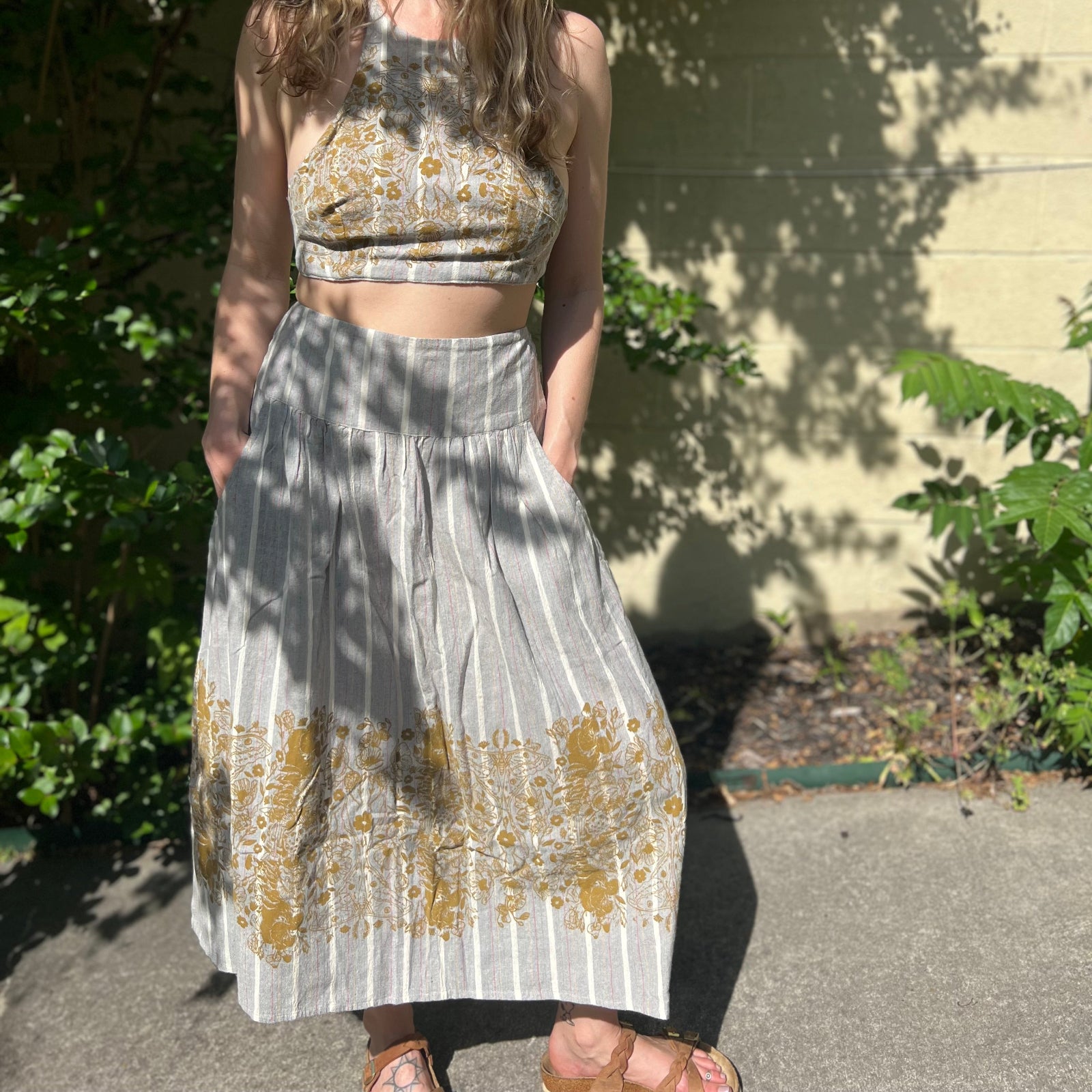 Someone wearing the gray Midnight Floral Midi Skirt.