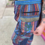 A woman wearing the Cotton Stone Wash OM & Peace Cargo Pants.