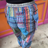 A woman wearing the Cotton Stone Wash OM & Peace Cargo Pants.