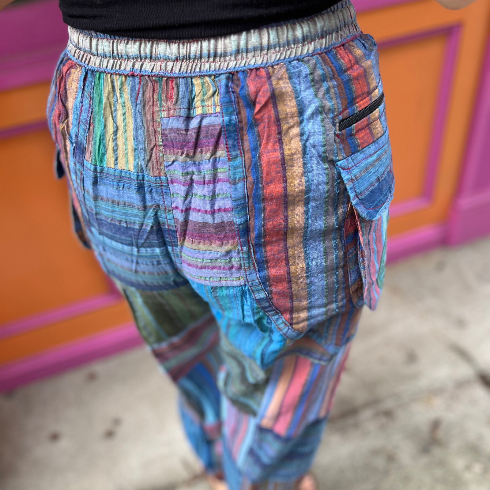 A woman wearing the Cotton Stone Wash OM & Peace Cargo Pants.