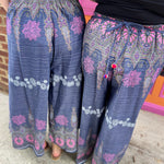 Two women wearing the Purple Floral Cotton Trousers.