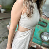 A woman wearing the cream Solid Linen Cut-Out Midi Dress in front of a vintage teal Volkswagen bus.