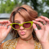 Someone wearing the Frenchie Seventies Cat-Eye Sunglasses with an orange patterned kimono.