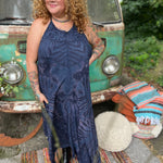 A woman wearing the spellbound Hippie Boho Maxi Flowy Tie Dye Dress in front of a vintage Volkswagen Bus.