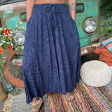 A woman wearing the navy Hippie Bohemian Hand Dyed Palazzo Pants in front of a vintage Volkswagen bus.