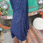 A woman wearing the navy Hippie Bohemian Hand Dyed Palazzo Pants in front of a vintage Volkswagen bus.