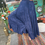 A woman wearing the navy Hippie Bohemian Hand Dyed Palazzo Pants in front of a vintage Volkswagen bus.