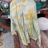 A woman wearing the green Hippie Bohemian Hand Dyed Palazzo Pants in front of a vintage Volkswagen bus.