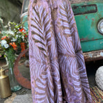 A woman wearing the mauve Hippie Bohemian Hand Dyed Palazzo Pants in front of a vintage Volkswagen bus.