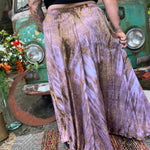 A woman wearing the mauve Hippie Bohemian Hand Dyed Palazzo Pants in front of a vintage Volkswagen bus.