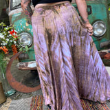 A woman wearing the mauve Hippie Bohemian Hand Dyed Palazzo Pants in front of a vintage Volkswagen bus.