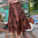 A woman wearing the brown Hippie Bohemian Hand Dyed Palazzo Pants in front of a vintage Volkswagen bus.