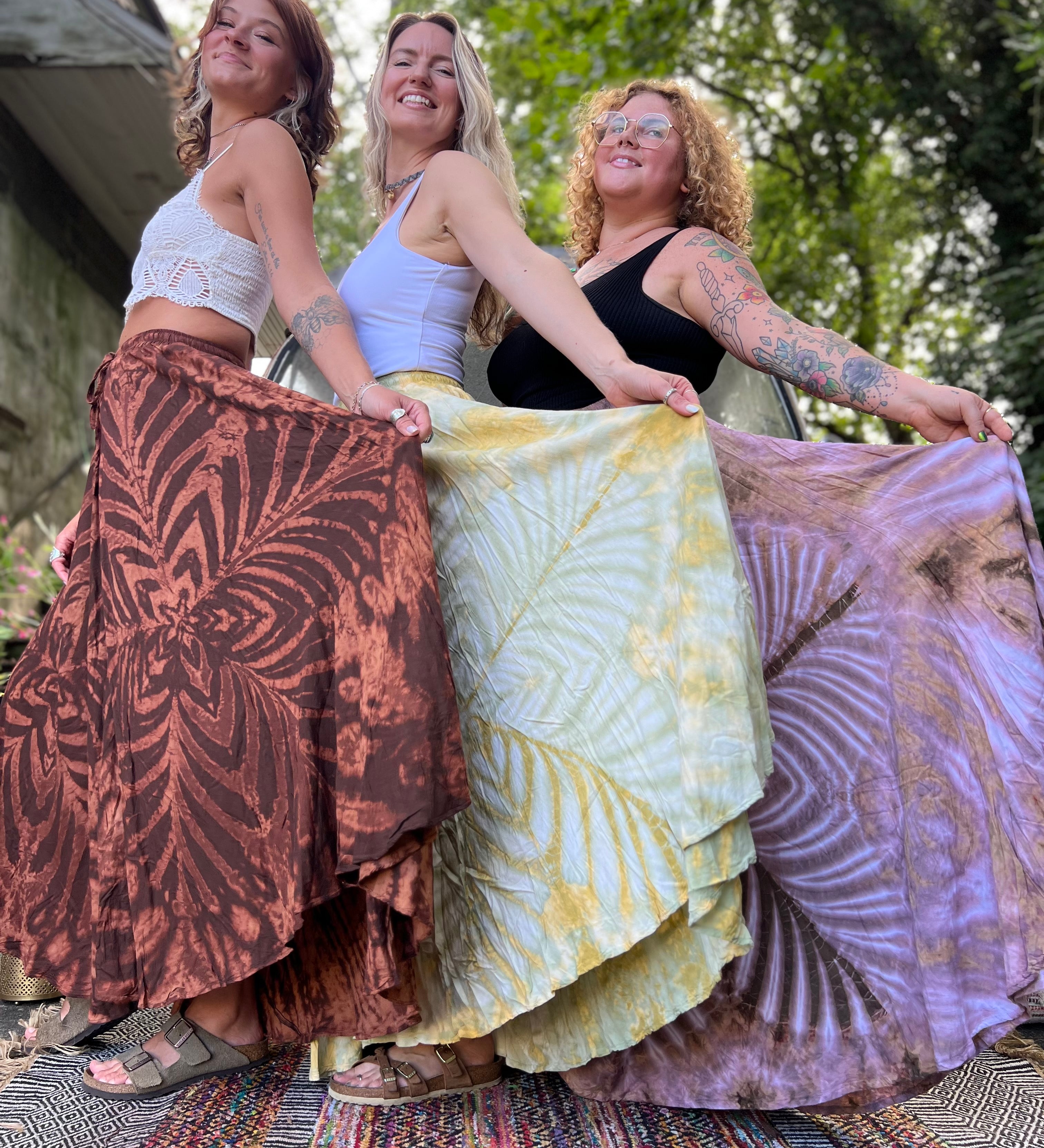 Three women wearing the different colors of the Hippie Bohemian Hand Dyed Palazzo Pants.