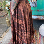 A woman wearing the brown Hippie Bohemian Hand Dyed Palazzo Pants in front of a vintage Volkswagen bus.