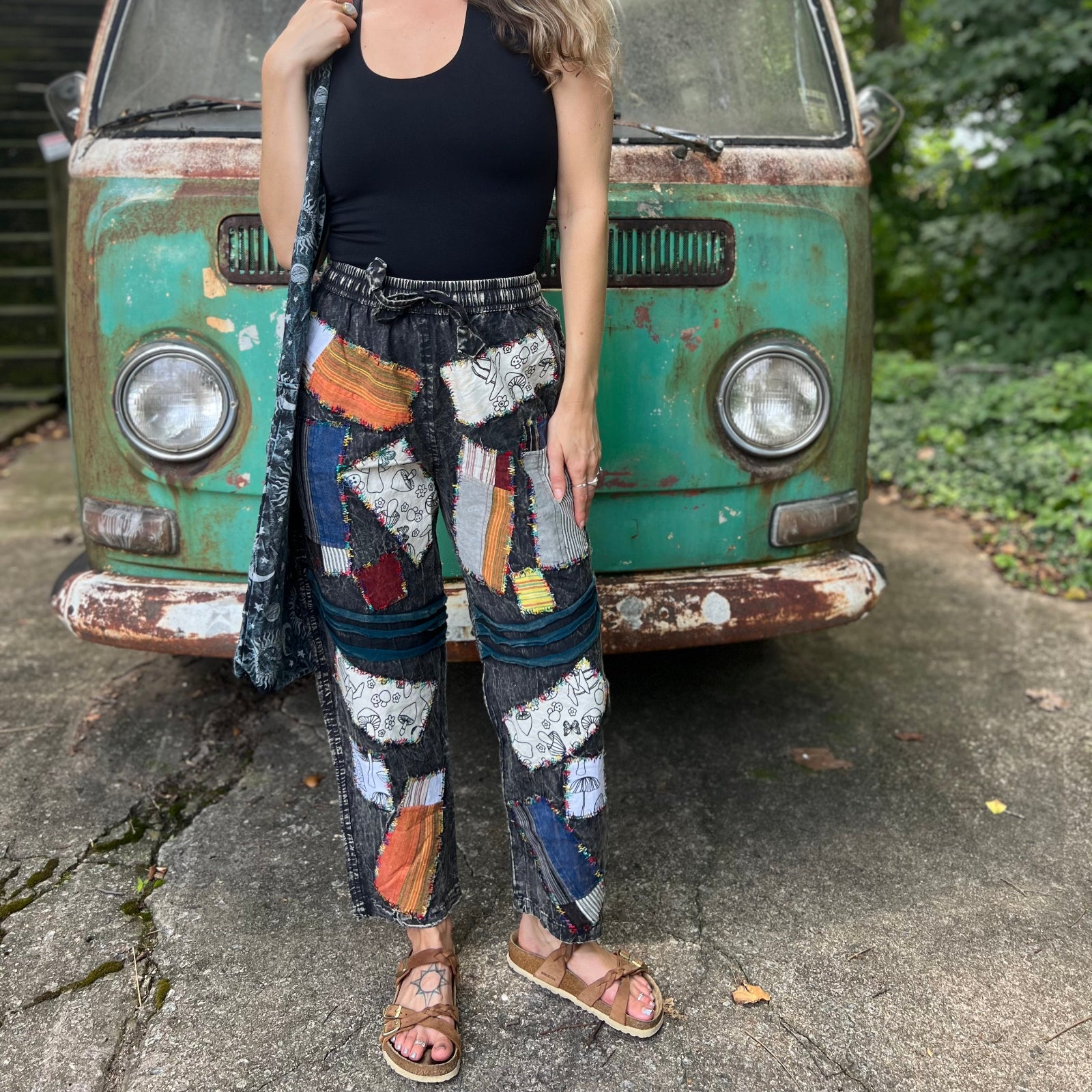 A woman wearing the Multi Patch Hippie Gypsy Cotton Trouser in front of a vintage Volkswagen bus.