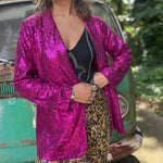 Someone wearing the Sequin Boyfriend Single Hot Pink Blazer in front of a vintage teal Volkswagen bus.