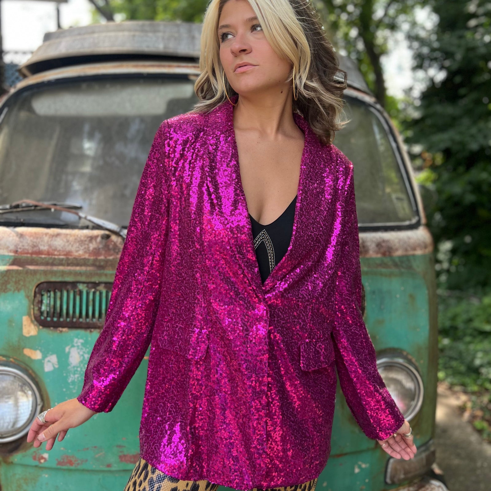 Someone wearing the Sequin Boyfriend Single Hot Pink Blazer in front of a vintage teal Volkswagen bus.