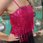 A woman wearing the hot pink Sequin Tiered Fringe Cami Tank in front of a teal vintage Volkswagen bus.