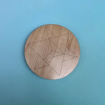 The 4 inch Merkabah Wooden Crystal Grid on a blue background.