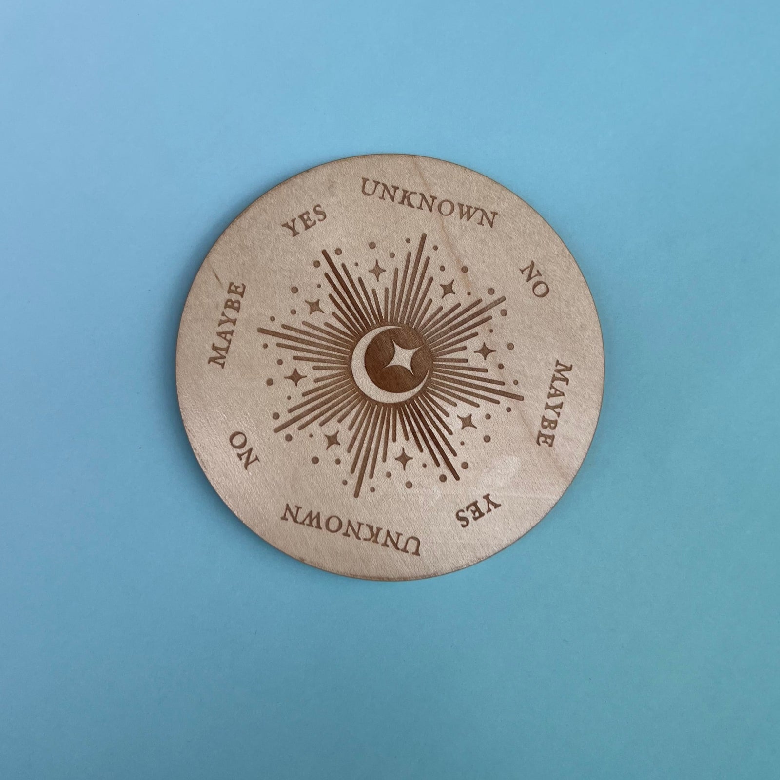 The Moonlight Pendulum Wooden 4 inch Board on a blue background.