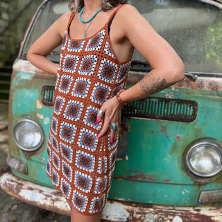 Someone wearing the coffee Sleeveless Knit Tank Dress in front of an old teal Volkswagen bus.