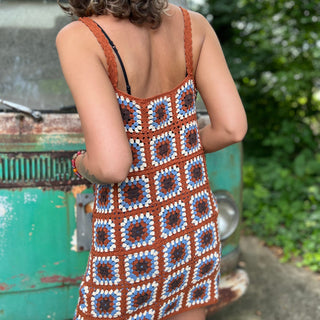 Someone wearing the coffee Sleeveless Knit Tank Dress in front of an old teal Volkswagen bus.