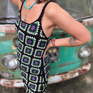 Someone wearing the black Sleeveless Knit Tank Dress in front of an old teal Volkswagen bus.