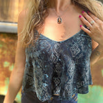 Someone wearing the Teal Spaghetti Strap Velvet Flowy Tank Top.