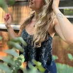 Someone wearing the Teal Spaghetti Strap Velvet Flowy Tank Top.