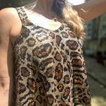 Someone wearing the Gold Cheetah Animal Print Flowy Sequin Tank.