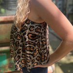 Someone wearing the Gold Cheetah Animal Print Flowy Sequin Tank.