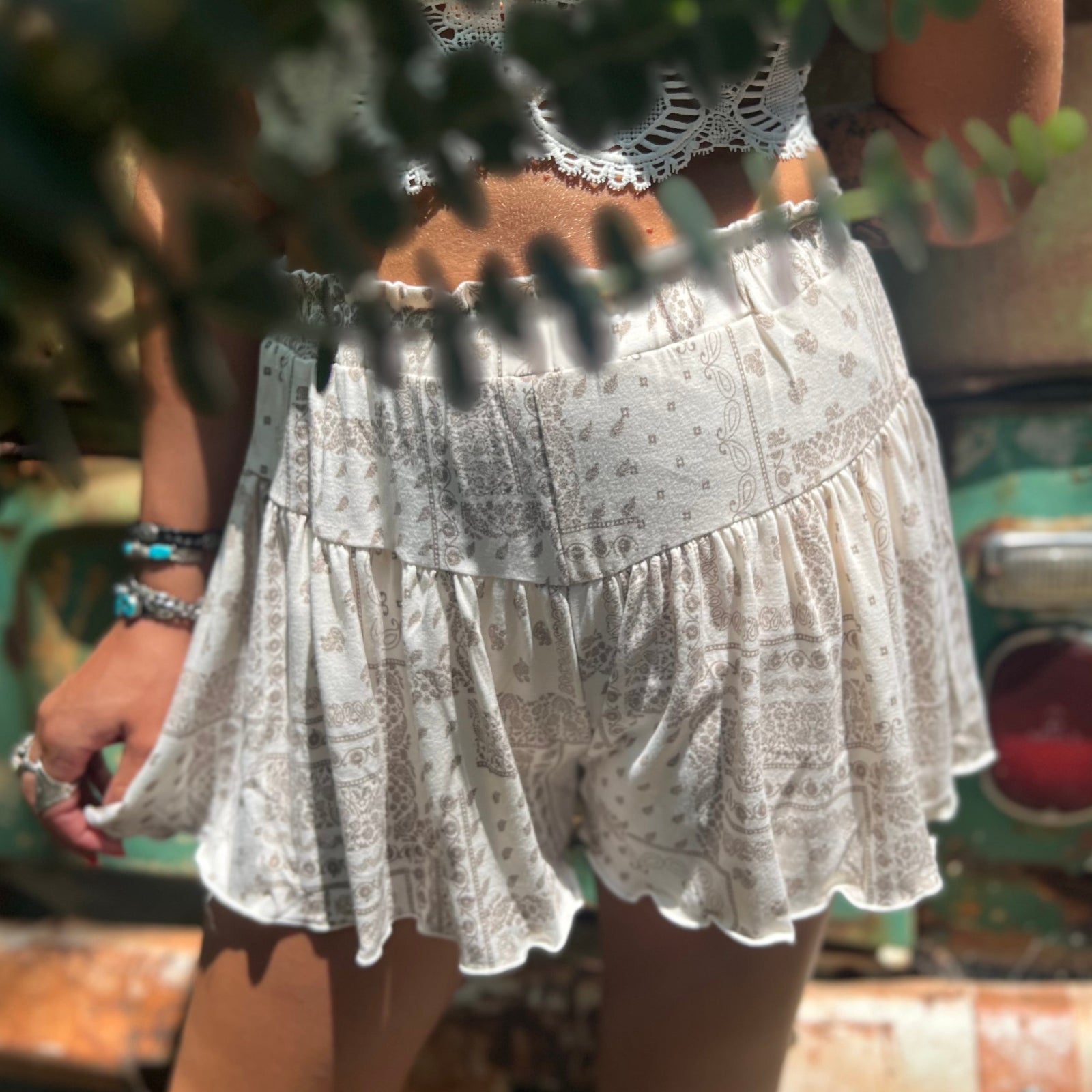 Someone wearing the Taupe Bandana Shorts with Elastic Waist.