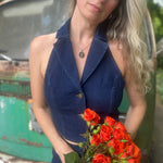 Someone wearing the Dark Wash Halter Neck Denim Vest.