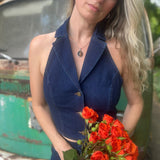 Someone wearing the Dark Wash Halter Neck Denim Vest.