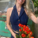 Someone wearing the Dark Wash Halter Neck Denim Vest.