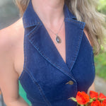 Someone wearing the Dark Wash Halter Neck Denim Vest.