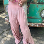 Someone wearing the mauve Smocking Waist Tier Wide Pants.