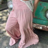 Someone wearing the mauve Smocking Waist Tier Wide Pants.
