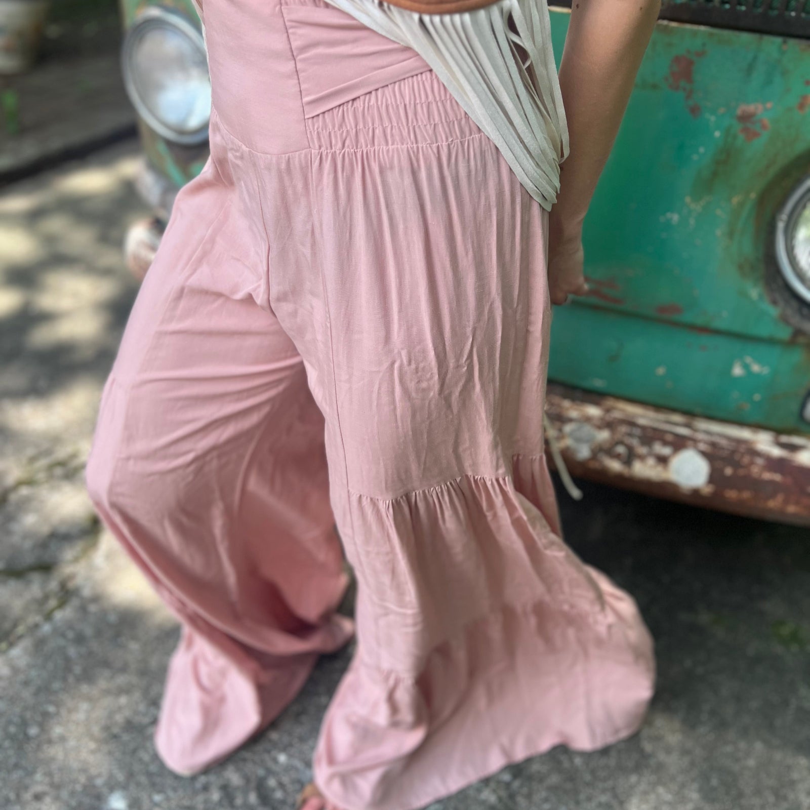 Someone wearing the mauve Smocking Waist Tier Wide Pants.