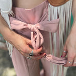 Someone wearing the mauve Smocking Waist Tier Wide Pants.