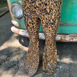 Someone wearing the Mustard Animal Print Bell Bottoms with Elastic Waist.